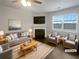 Bright, staged living room with a fireplace, large windows, and comfortable seating at 1260 Brookstone Cir, Conyers, GA 30012