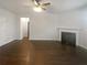 Spacious living room with a fireplace and dark wood floors at 1260 Brookstone Cir, Conyers, GA 30012
