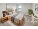 Staged bedroom with a neutral color palette, soft lighting, and modern decor at 1260 Brookstone Cir, Conyers, GA 30012