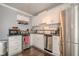 Compact kitchen with stainless steel appliances and white cabinets at 1269 Monroe Drive Ne, Atlanta, GA 30306