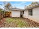 Backyard view featuring a white brick home exterior at 2026 Swazey Dr, Decatur, GA 30032