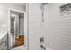 Modern bathroom with white subway tile shower and glass door at 2026 Swazey Dr, Decatur, GA 30032