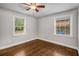 Cozy bedroom with hardwood floors and a ceiling fan at 2026 Swazey Dr, Decatur, GA 30032