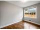 Bright bedroom with hardwood floors and large window overlooking backyard at 2026 Swazey Dr, Decatur, GA 30032