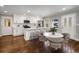 Beautiful eat-in kitchen features white cabinets, stainless steel appliances, and a stylish marble top breakfast table at 2026 Swazey Dr, Decatur, GA 30032