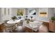 Open-concept living room featuring sleek hardwood floors, a modern sofa set, and great natural light at 2026 Swazey Dr, Decatur, GA 30032