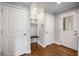 Hallway with a storage cubby, bench, and access to other rooms at 2026 Swazey Dr, Decatur, GA 30032