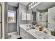 Bathroom showcasing a double sink vanity, ample storage, and a separate shower area at 340 Willow Crescent Way, Johns Creek, GA 30022
