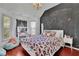 A whimsical bedroom with a charming chandelier, chalkboard wall, and cozy decor at 340 Willow Crescent Way, Johns Creek, GA 30022