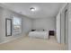 Bedroom with neutral carpet, a large window, and classic furnishings at 340 Willow Crescent Way, Johns Creek, GA 30022