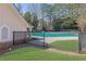 The community pool is enclosed by a black fence, offering a safe and private area for residents to enjoy swimming at 340 Willow Crescent Way, Johns Creek, GA 30022