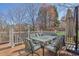 Outdoor deck with a table and chairs, ideal for outdoor dining at 340 Willow Crescent Way, Johns Creek, GA 30022