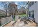 Deck with outdoor seating and a playset in the background at 340 Willow Crescent Way, Johns Creek, GA 30022