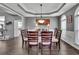 Traditional dining room with hardwood floors and arched windows offering plenty of natural light at 340 Willow Crescent Way, Johns Creek, GA 30022