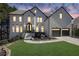Beautiful two-story home featuring a brick facade, well-manicured lawn, and a two-car garage at 340 Willow Crescent Way, Johns Creek, GA 30022