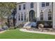 Close-up of beautiful home's front yard, featuring lush landscaping, and walkway to the beautiful front door at 340 Willow Crescent Way, Johns Creek, GA 30022