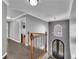Second floor hallway with hardwood floors, chandelier, and window overlooking the front door at 340 Willow Crescent Way, Johns Creek, GA 30022