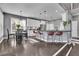 Modern kitchen featuring stainless steel appliances, bar seating, and an adjacent dining area at 340 Willow Crescent Way, Johns Creek, GA 30022