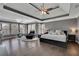 Main bedroom features hardwood floors, tray ceiling, sitting area and lots of natural light at 340 Willow Crescent Way, Johns Creek, GA 30022