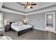 Spacious main bedroom with hardwood floors, tray ceiling, and bedside tables at 340 Willow Crescent Way, Johns Creek, GA 30022
