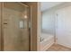 Bathroom featuring a separate shower, garden tub, and tile flooring at 4310 Alysheba Dr, Fairburn, GA 30213