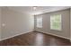 Bedroom featuring hardwood flooring and a double window at 4310 Alysheba Dr, Fairburn, GA 30213