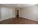 Bedroom with hardwood flooring, closet, and a ceiling light at 4310 Alysheba Dr, Fairburn, GA 30213