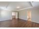 Bedroom featuring hardwood floors, neutral walls, crown molding and an ensuite bathroom at 4310 Alysheba Dr, Fairburn, GA 30213