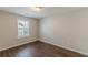 Cozy bedroom featuring wood-look flooring and a bright window, creating a relaxing atmosphere at 4310 Alysheba Dr, Fairburn, GA 30213