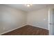 Inviting bedroom boasts wood-look floors and a bright window, creating a relaxing atmosphere at 4310 Alysheba Dr, Fairburn, GA 30213