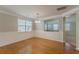 Formal dining room with hardwood floors and decorative wall trim, with a view to living area at 4310 Alysheba Dr, Fairburn, GA 30213
