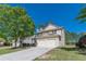 Beautiful two-story home featuring a two-car garage, well-kept lawn and mature trees at 4310 Alysheba Dr, Fairburn, GA 30213