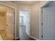 Hallway with multiple doors and wood flooring at 4310 Alysheba Dr, Fairburn, GA 30213
