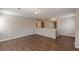Hallway featuring hardwood floors, neutral walls, natural light and access to other rooms at 4310 Alysheba Dr, Fairburn, GA 30213
