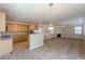 View of the home showcasing an open-concept layout with kitchen featuring granite countertops and living room with a fireplace at 4310 Alysheba Dr, Fairburn, GA 30213