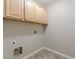 Laundry room with tile flooring and upper cabinets at 4310 Alysheba Dr, Fairburn, GA 30213