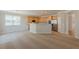 Open floor plan featuring a living room and kitchen area with stainless steel appliances and plenty of natural light at 4310 Alysheba Dr, Fairburn, GA 30213