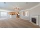 Open living area features a fireplace, kitchen with island, and ample space for relaxation at 4310 Alysheba Dr, Fairburn, GA 30213
