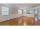 Bright living room with hardwood floors, wainscoting detail, and large windows at 4310 Alysheba Dr, Fairburn, GA 30213