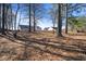 Large wooded backyard with fence, landscaping, and spacious area for outdoor activities at 923 Wexford Way, Auburn, GA 30011