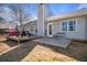 View of the home's back exterior with a patio, picnic table, and privacy fence at 923 Wexford Way, Auburn, GA 30011