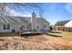 View of the backyard featuring a deck, grill, and gray siding on the house at 923 Wexford Way, Auburn, GA 30011