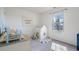 Cozy bedroom with a playhouse, natural light, and neutral carpeting at 923 Wexford Way, Auburn, GA 30011