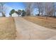 Long driveway leading up to a two car garage and house at 923 Wexford Way, Auburn, GA 30011