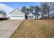 Charming single-story home features a two-car garage and manicured landscaping at 923 Wexford Way, Auburn, GA 30011