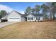 Charming single-story home features a two-car garage and manicured landscaping at 923 Wexford Way, Auburn, GA 30011