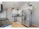 A functional kitchen with granite countertops, stainless steel appliances, and a view to the backyard at 923 Wexford Way, Auburn, GA 30011