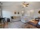 Spacious living area with cozy seating, vaulted ceiling and neutral color palette at 923 Wexford Way, Auburn, GA 30011