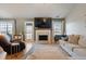 Bright living room boasts a fireplace and ample seating at 923 Wexford Way, Auburn, GA 30011
