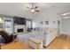 Spacious living room with a fireplace, large sectional sofa, and plenty of natural light at 923 Wexford Way, Auburn, GA 30011